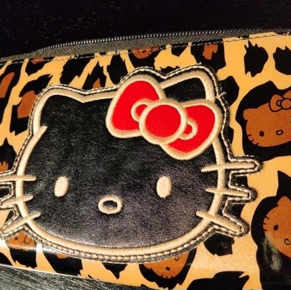Hello Kitty Handbags - Large Leapard animal print and red Hello Kitty Wallet.